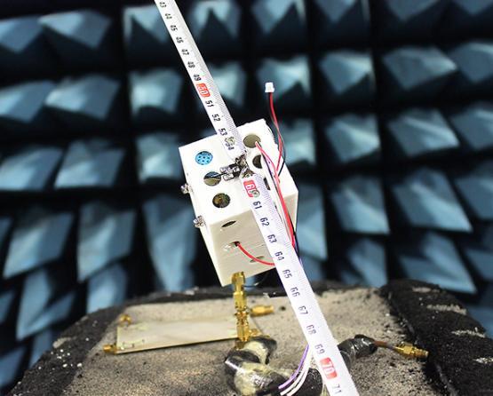 Close-up of the picosatellite engineering model payload board, mounted on RF absorber foam
